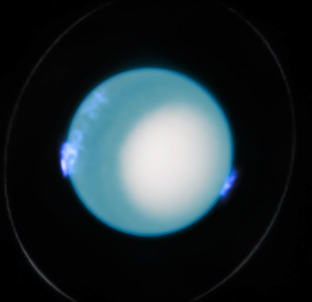 She’s different, but shines in her own way 🌞
 
In this photo of Uranus captured by @NASAHubble, its auroras are on full display. But unlike other members of the Solar System, the pair of auroras shine on Uranus’s left and right sides instead of at the top and bottom of the planet.
 
This is because of how the magnetic poles of Uranus are oriented. Most planets in our Solar System – like Earth – have magnetic poles on opposite vertical ends of the planet, with some tilting slightly to the side. Uranus, however, is the maverick of the planetary family. Its magnetic poles sit on opposite horizontal ends of the planet, as if the planet was lying on its side.
 
Auroras happen when energetic particles from the Sun collide with a planet’s magnetic shield, transferring their energy to particles in the planet’s atmosphere. When that built-up energy is released, it creates a light show emanating from the magnetic poles. Since Uranus has horizontal poles rather than vertical, its auroras appear on the left and right sides of the planet.
 
Image description: The sky blue planet of Uranus is centered against black space, glowing with deep blue auroras on its right and left sides. One of its rings is visible as a faint, white circle around the planet.
 
Credit: ESA/Hubble, NASA, L. Lamy, L. Sromovsky
 
#NASA #ESA #Uranus #Aurora #Planets #SolarSystem