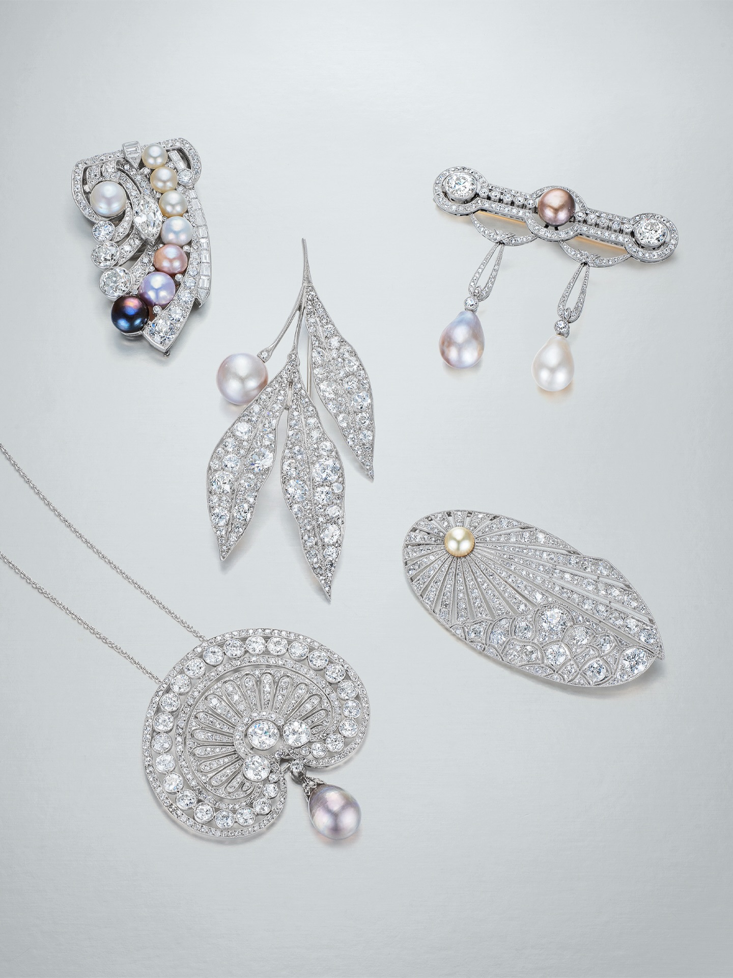 A study in refinement and form, these early 20th-century creations celebrate the delicate interplay between natural pearls and diamonds. Each design reflects a different expression of the era’s artistry — from botanical motifs to radiating fans — capturing the grace and innovation that defined the period’s aesthetic.

#worthyofcollection #mandarinoriental #mandarinorientalhongkong #ronaldabram