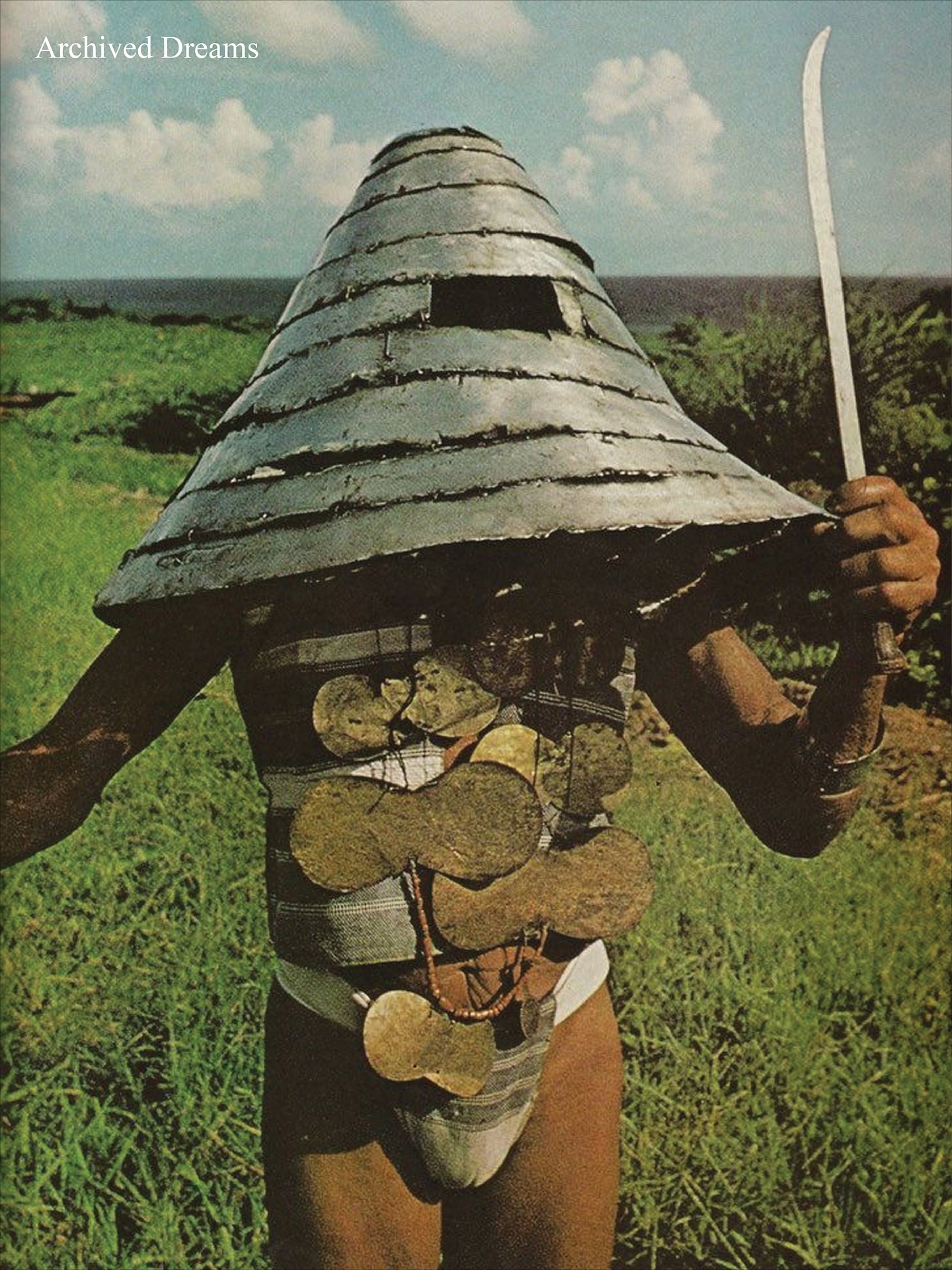 The Tao Men of Lanyu and Their Ceremonial Helmets

Off the coast of Taiwan lies Lanyu, or Orchid Island, home to the Tao people, also known as Yami. Settled around 800 years ago by migrants from the Philippines’ Batanes Islands, the Tao rely on fishing and boat-building, which form the backbone of their culture and spiritual practices.

Traditional Tao clothing is simple and practical: men wear loincloths and vests, women cover their upper bodies with short vests and aprons. For ceremonies, vibrant blue-and-white vests are added, along with striking accessories,women wear octagonal wooden hats, men wear silver helmets.

These silver helmets, made by melting Spanish silver coins that reached the island via trade routes through the Philippines, are not for protection. Instead, they signify wealth and hold spiritual significance, used to bless homes, fields, boats, and even to attract fish at the start of the fishing season. The helmets grow larger as wealth accumulates, embodying both status and tradition in Tao society.

With modern emigration threatening the continuity of these practices, the silver helmets remain a powerful symbol of the Tao people’s connection to the sea, their heritage, and their enduring cultural identity.

What are your thoughts? 💭