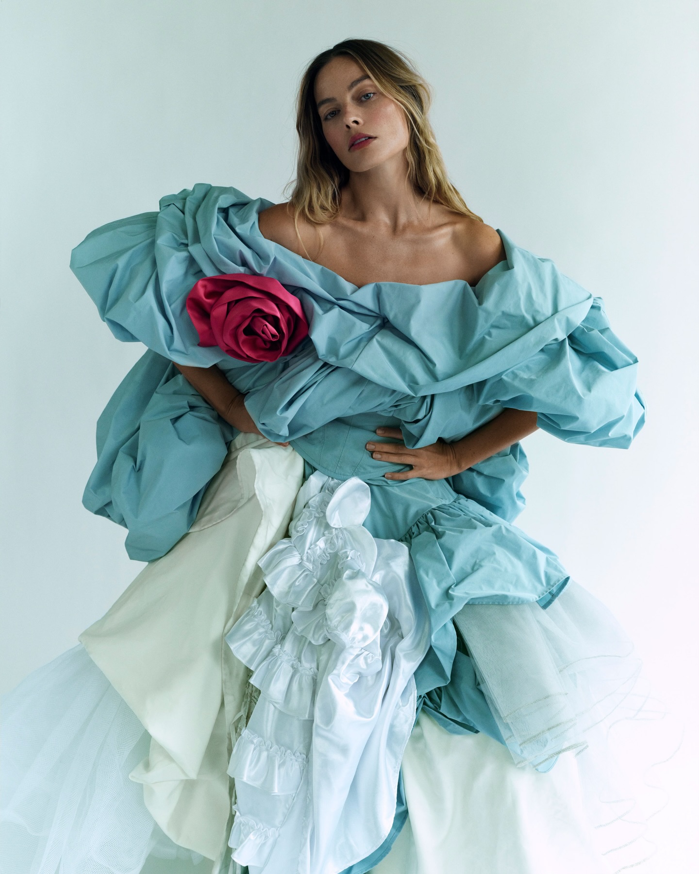 #WutheringHeights is #EmeraldFennell’s sweaty, sensual, skin-crawling, deliberately fantastical fever dream with glossy red lacquered floors, heaving bosoms and outlandish, eye-popping costumes – all soundtracked by #CharliXCX. #MargotRobbie was completely captivated by Fennell’s Cathy as soon as she read the script. “I just felt like, not like she’s mine, but like I both understood her and didn’t, in a way that drew me to her,” she says in the January 2026 issue. “It’s this puzzle you have to work out.” Click the link in bio to read the interview, and see the full story in the new issue, on newsstands Tuesday 16 December.

Margot Robbie photographed by @MikaelJansson and styled by @RobbieSpencer, with hair by @BryceScarlett, make-up by @PatiDubroff, nails by @AmaQuashie, tailoring by @_DellaGeorge, set design by @MaxBellhouse and production by @HolmesProduction, with thanks to @FirlePlace, East Sussex.

[Image Description: Image one shows Margot Robbie against a white background, looking into the camera while wearing a blue dress with voluminous sleeves and ruffles. Her blonde hair is loose around her face, and her hands are on her hips.

Image two shows a blue background with white writing that reads: “Everyone’s expecting this to be very, very raunchy. I think people will be surprised. It’s more romantic than provocative – Margot Robbie”.

Image three is in black and white, and shows Margot Robbie looking into the camera while wearing a dress with long pale knitted sleeves and ruffles at the neck and at the end of her sleeves. It’s raining heavily behind her and her face and hair are soaked.]