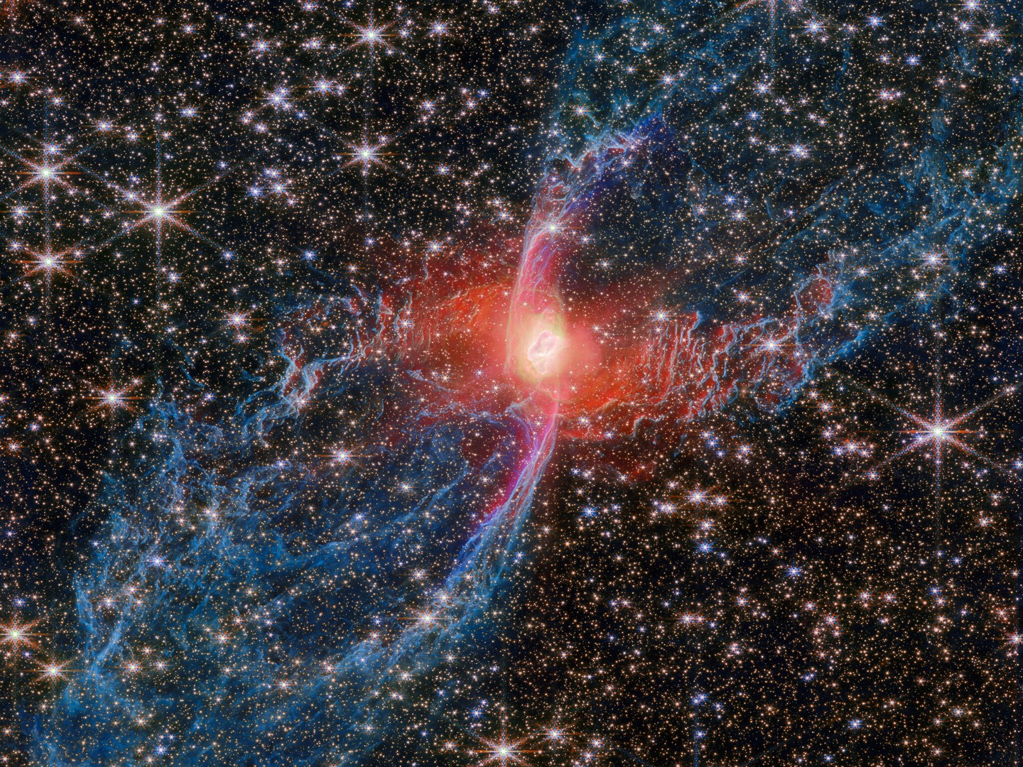 Spider Nebula, Spider Nebula⁣
Does whatever a Spider Nebula does 🎵⁣

@NASAWebb was recently able to capture never-before-seen details of the very photogenic Red Spider Nebula. For the first time, we can see the full extent of the nebula’s lobes (in blue), and we can tell that the lobes are closed, bubble-like structures that each extend about 3 light-years.⁣

Planetary nebulae like this one are made when a Sun-like star reaches the end of its life. After ballooning into a red giant, the star then throws off its outer layers into space, revealing its white-hot core. Ultraviolet light from the central star causes the cast-off material to glow.⁣

Though we can only see one star – the central star – here, it’s possible that there is a companion star, too. Its presence could explain the nebula’s shape: the characteristic narrow waist and wide outflows.⁣

Image description: A multicolored nebula stands out against the star-studded background of space. The nebula’s central star is hidden by a blotchy pinkish cloud of dust. A strong red light radiates from this area, lighting up the nearby dust. An elongated purple ‘S’ shape is centered on the heart of the nebula, while two blue lobes stretch diagonally outward to the edges of the image, making the entire structure look like a tilted hourglass.⁣

Credit: ESA/Webb, NASA & CSA, J. H. Kastner (Rochester Institute of Technology)⁣

#NASA #Webb #Telescope #Nebula #Stars #Space