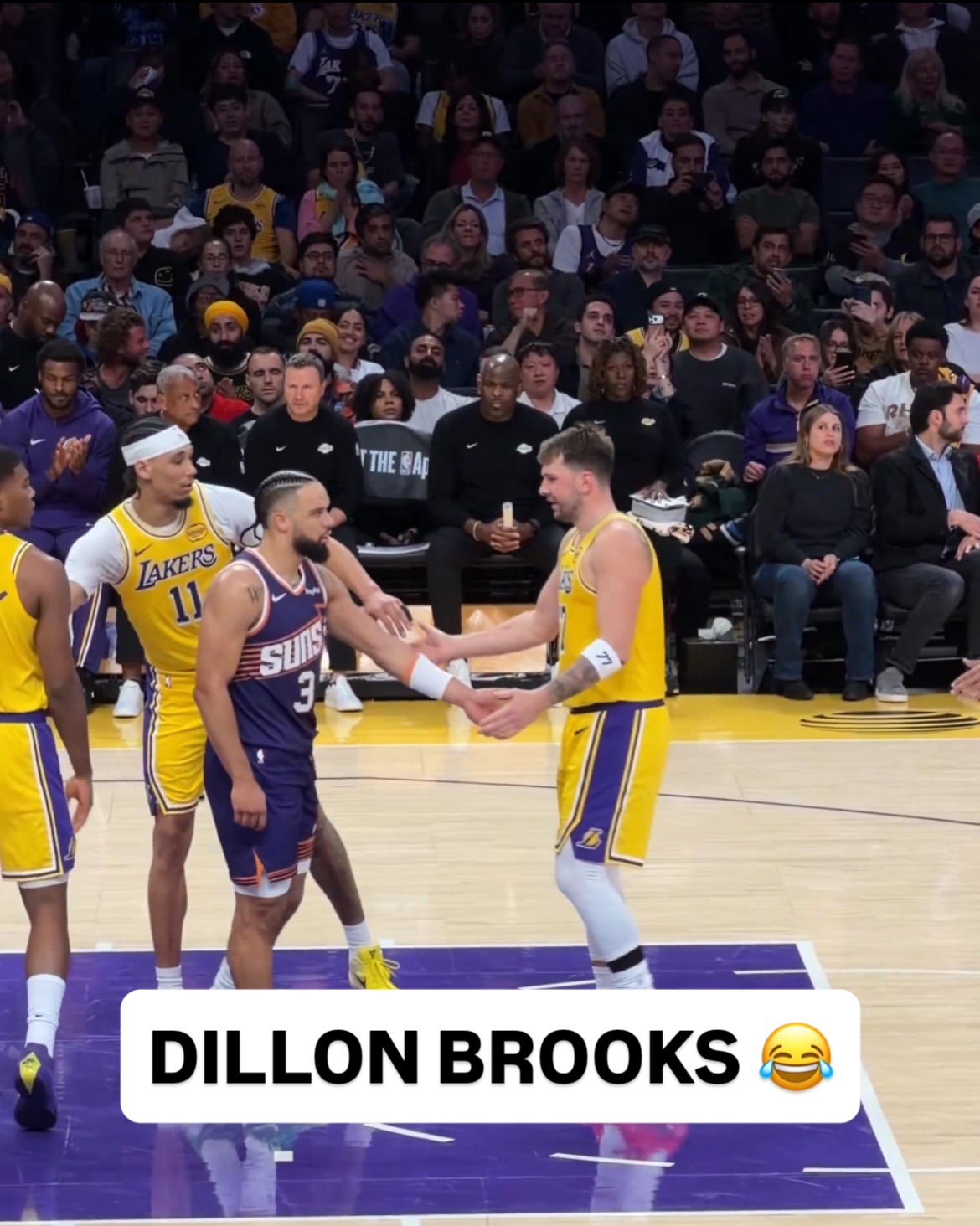 Dillon Brooks got Luka with the high 5 lol (via @lakersalldayeveryday)